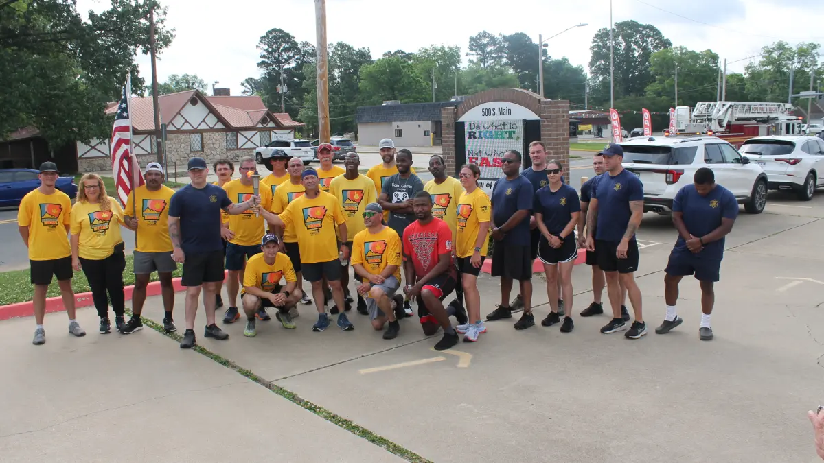 Good Crowds Greet Law Enforcement Torch Run for Special Olympics Which Takes Route Through Hope 